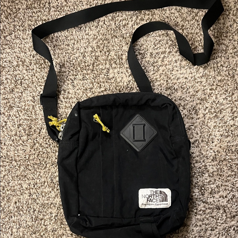 The North Face Black Messenger Bag with Yellow Accents